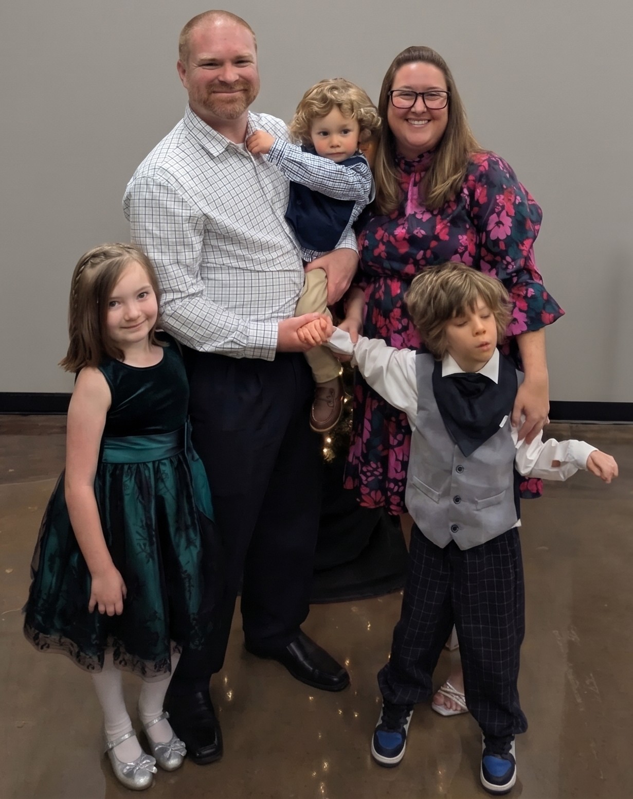 Ben Noble with his wife, Amy, and their three children.